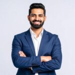 portrait of a young indian businessman with his arms crossed over his chest free photo